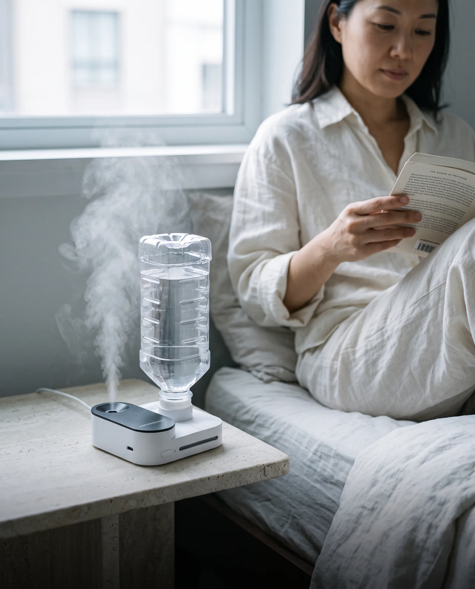 Illustrative person reading in a softly lit bedroom