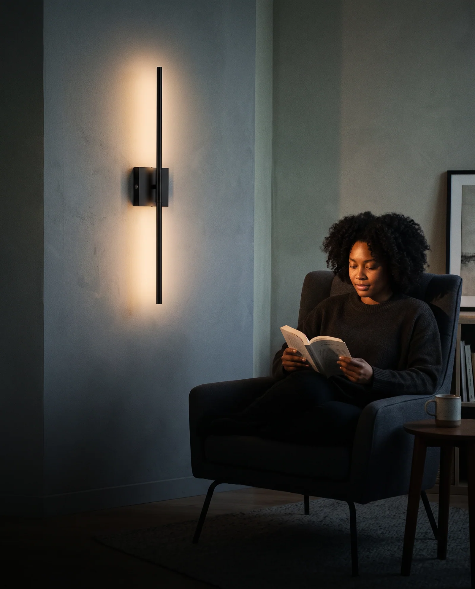 Illustrative reading chair next to a softly lit wall