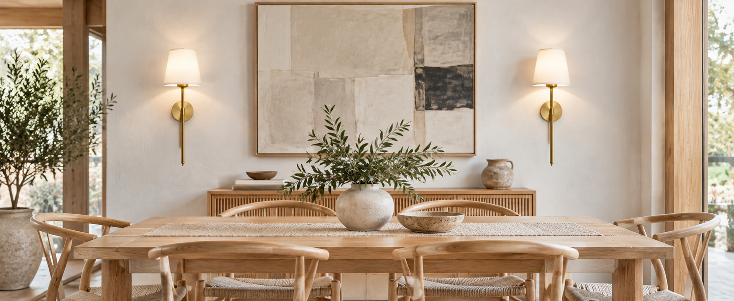 Gold wall sconces in a dining room. Product imagery supplied for the rechargeable gold wall sconce pair.